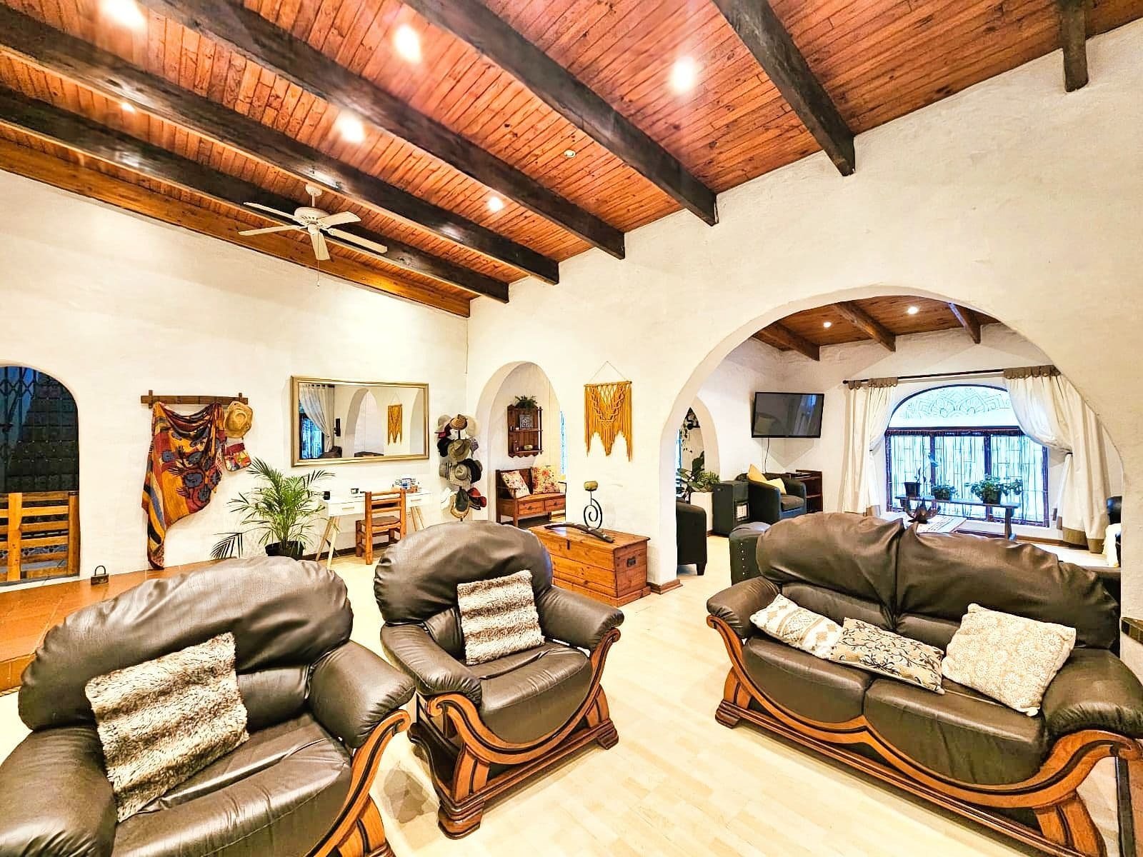 Main living area with timber-beam ceiling