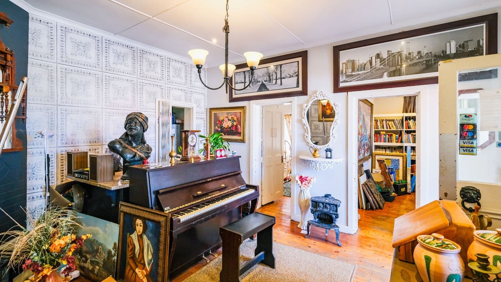 Living area with piano and timber floors
